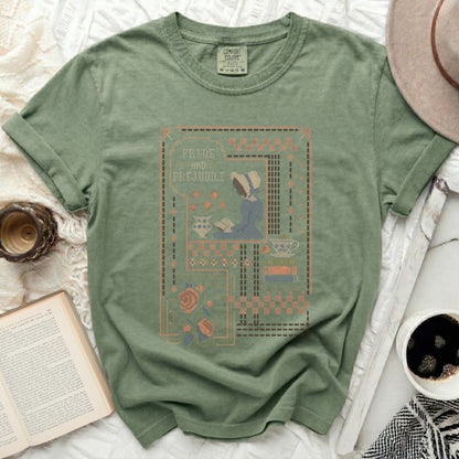 Green t-shirt featuring a cross-stitch design of Jane Austen's "Pride and Prejudice" book cover.