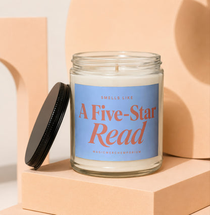 Candle with blue label reading "Smells Like A Five-Star Read MagicMerchEmporium".