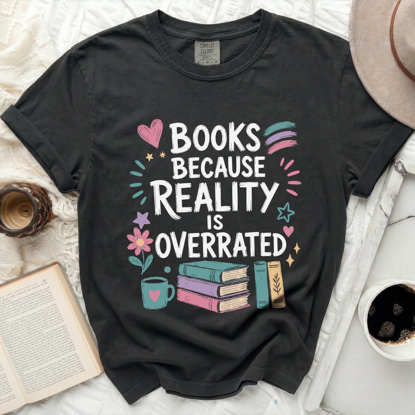 Black t-shirt with "Books Because Reality Is Overrated" text, books, and heart.