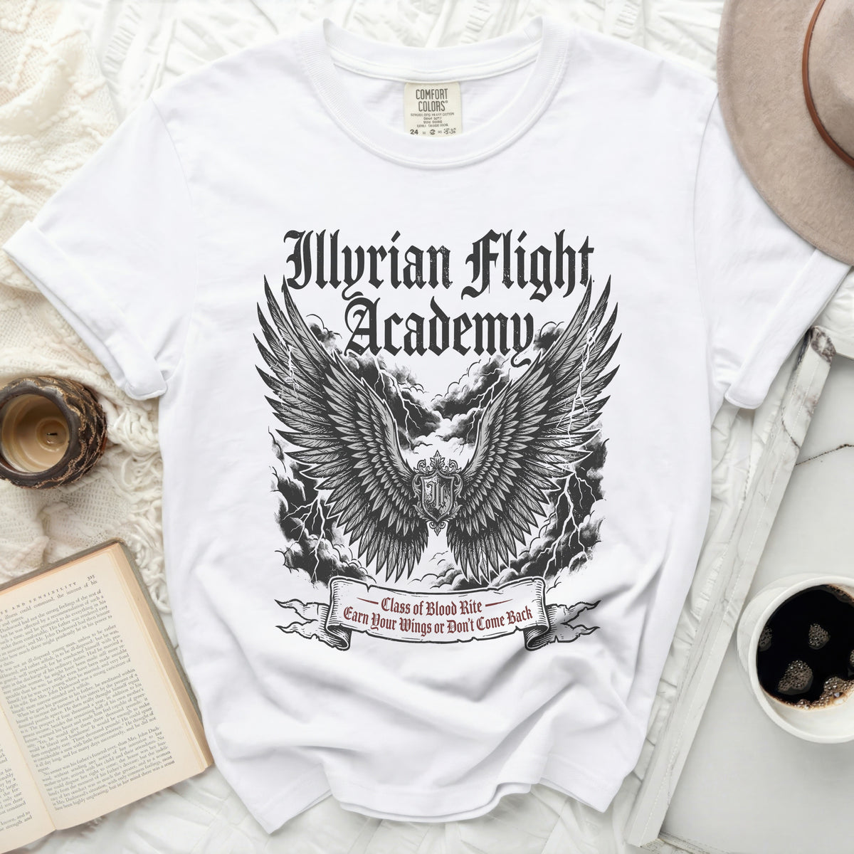 Illyrian Flight Academy white t-shirt with wings and lightning graphic.