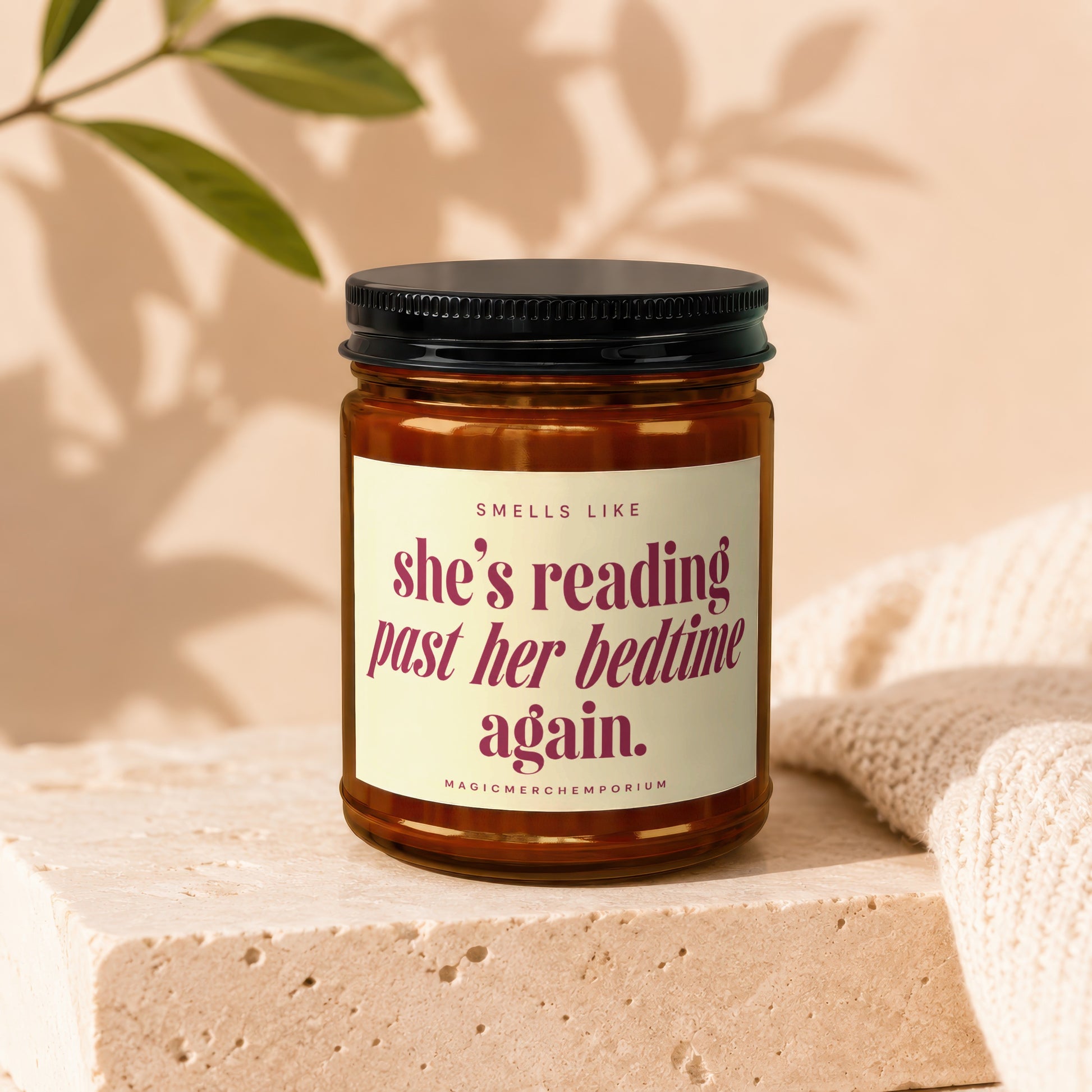 Candle with "she's reading past her bedtime again." text.