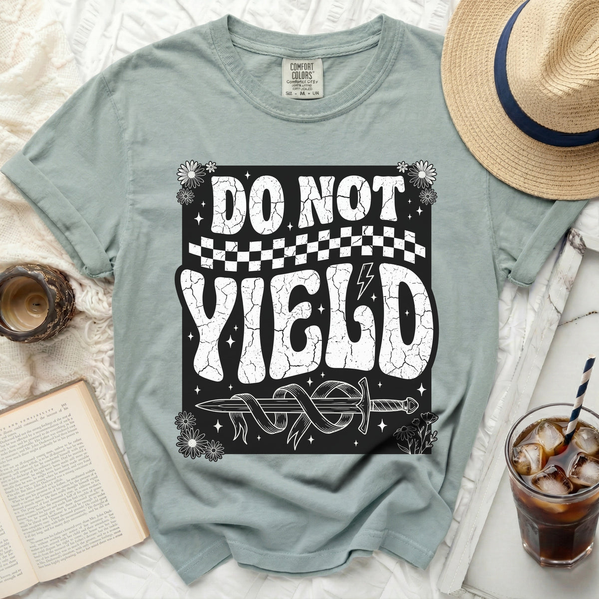 T-shirt with "DO NOT YIELD" and a sword graphic.