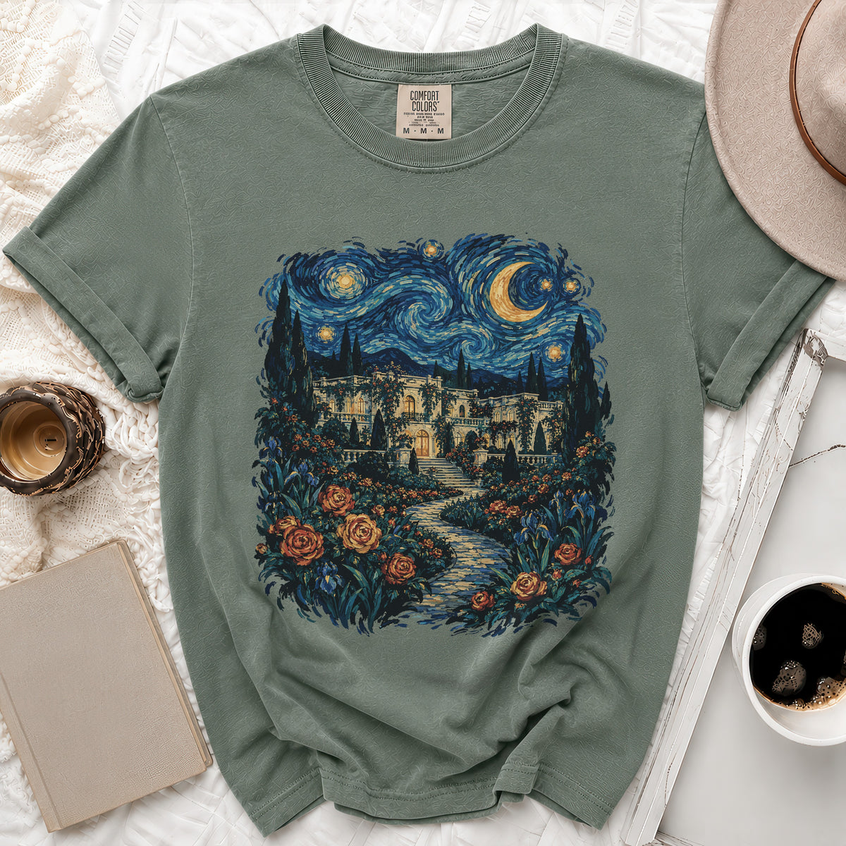 Green t-shirt with a swirling starry night sky and villa garden print.