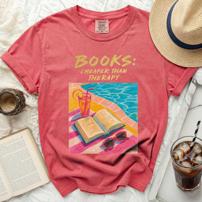 Red t-shirt with "Books: Cheaper Than Therapy" graphic and open book illustration.