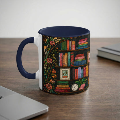 Mug with navy handle featuring a stained-glass effect bookshelf design and roses.
