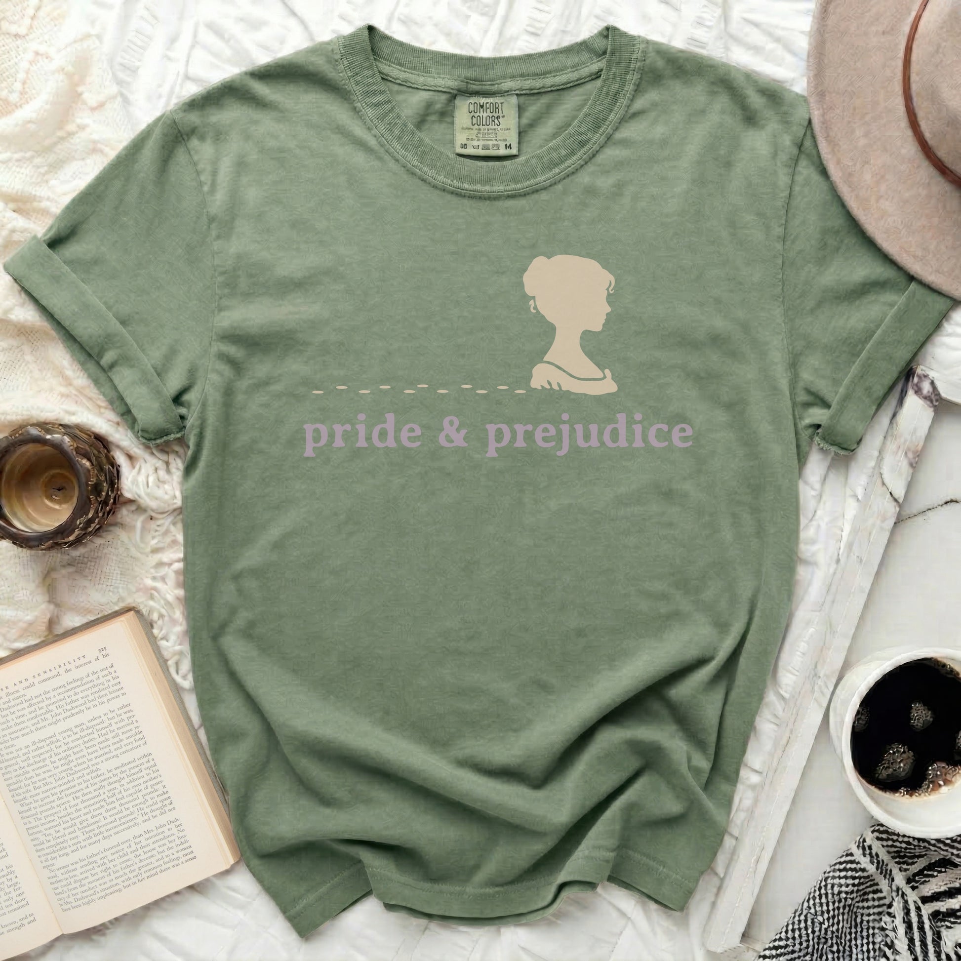 Olive green t-shirt with "pride & prejudice" and silhouette.