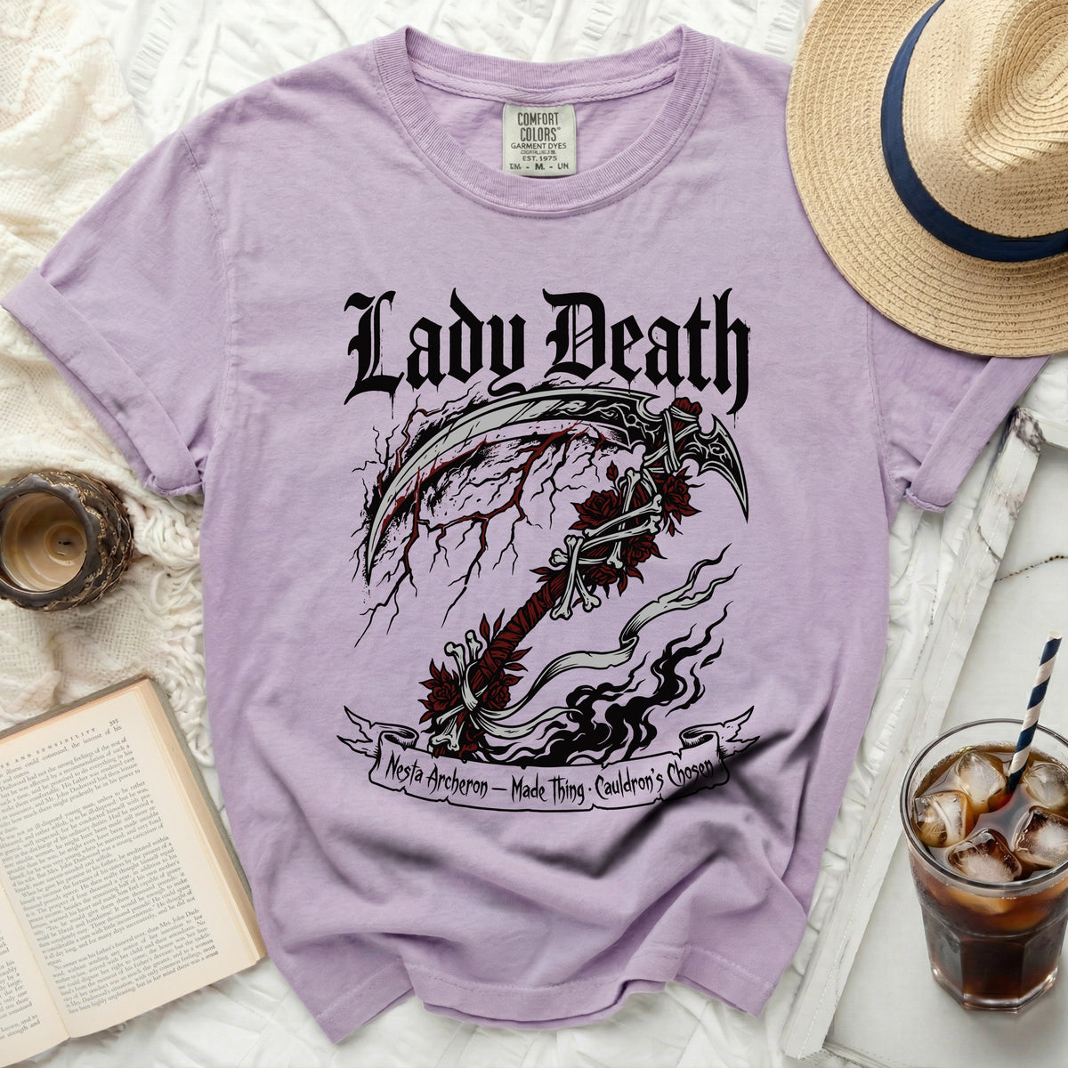 Purple t-shirt with "Lady Death" text and a scythe graphic.
