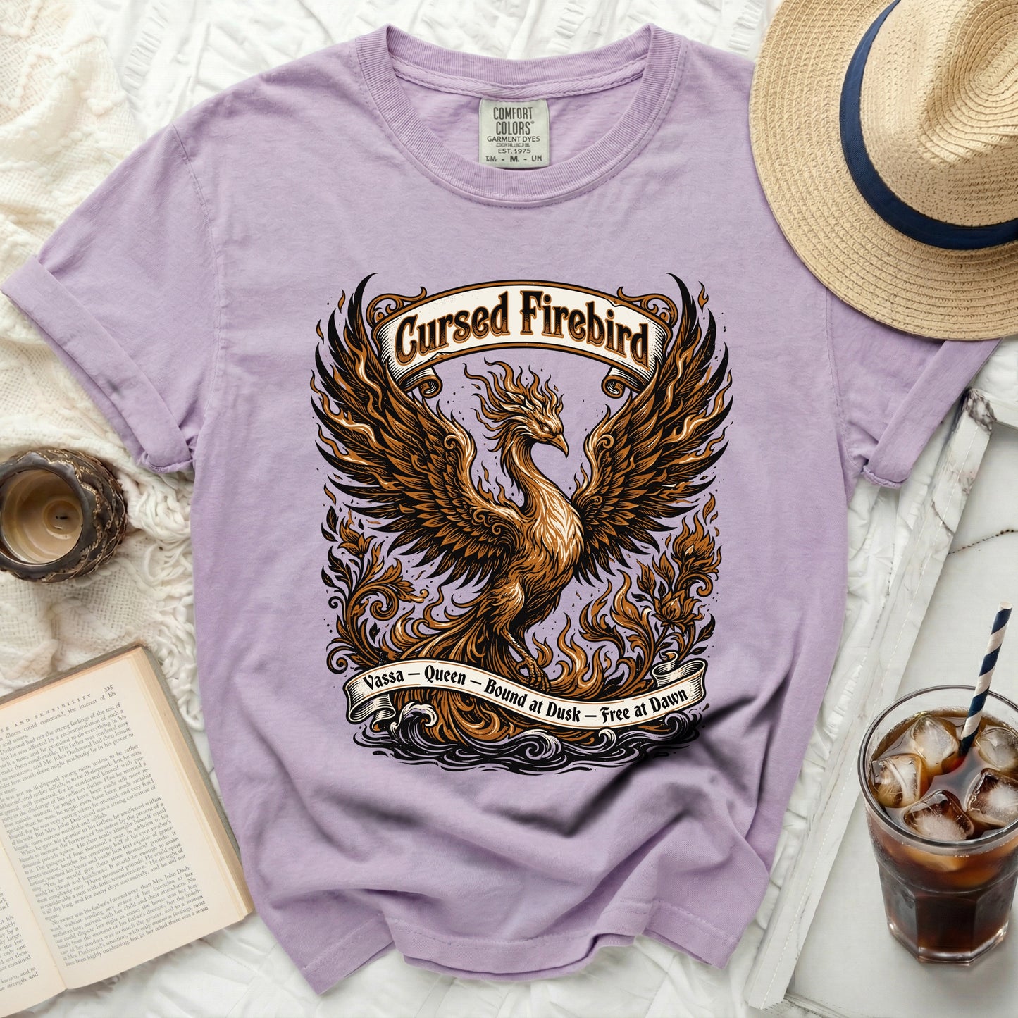 Purple t-shirt with a "Cursed Firebird" graphic and text.