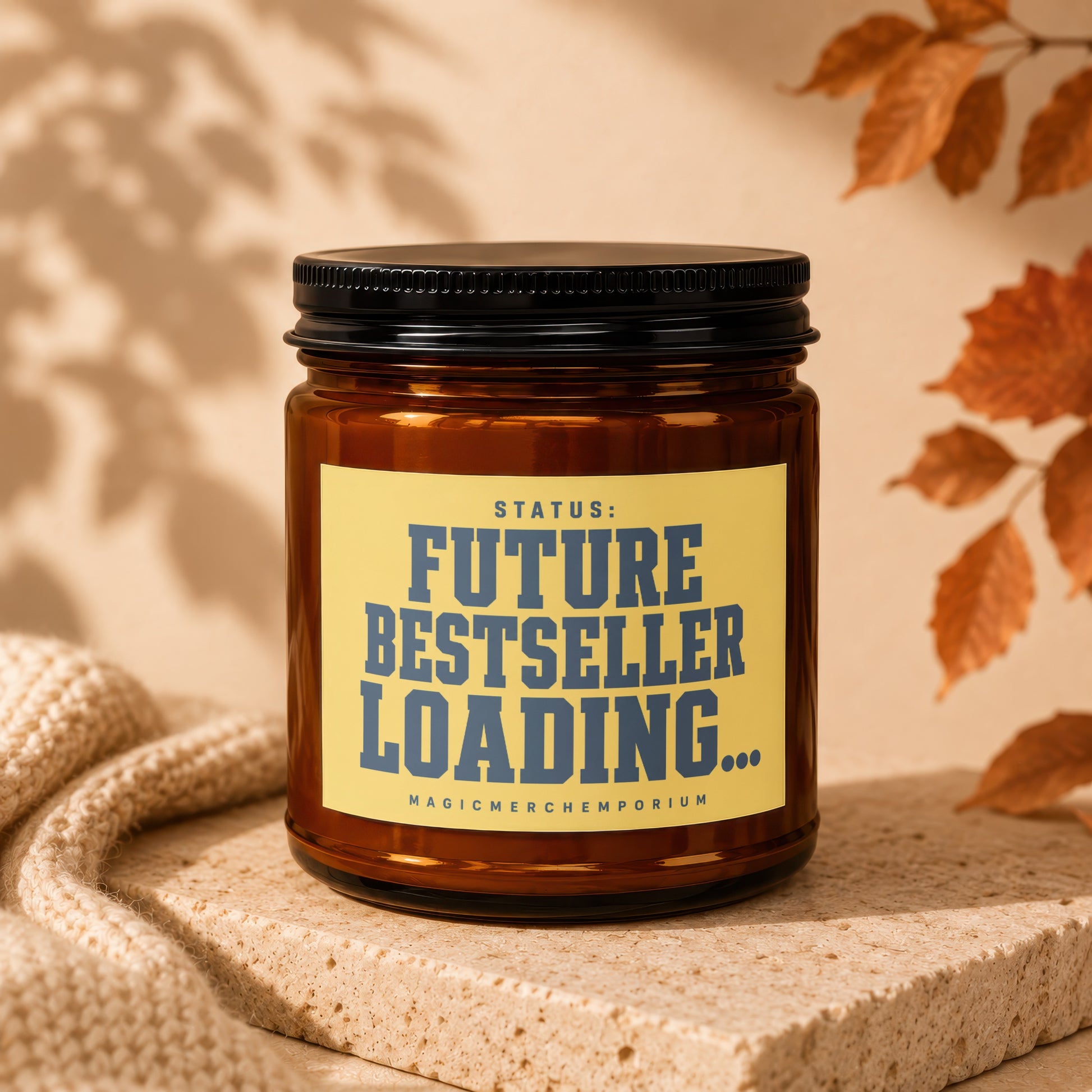 Amber jar candle with yellow label reading "STATUS: FUTURE BESTSELLER LOADING..."