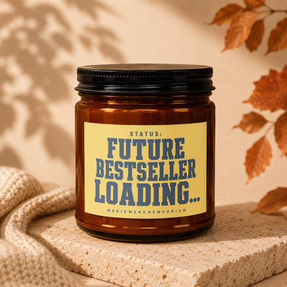 Amber jar candle with yellow label reading "STATUS: FUTURE BESTSELLER LOADING..."