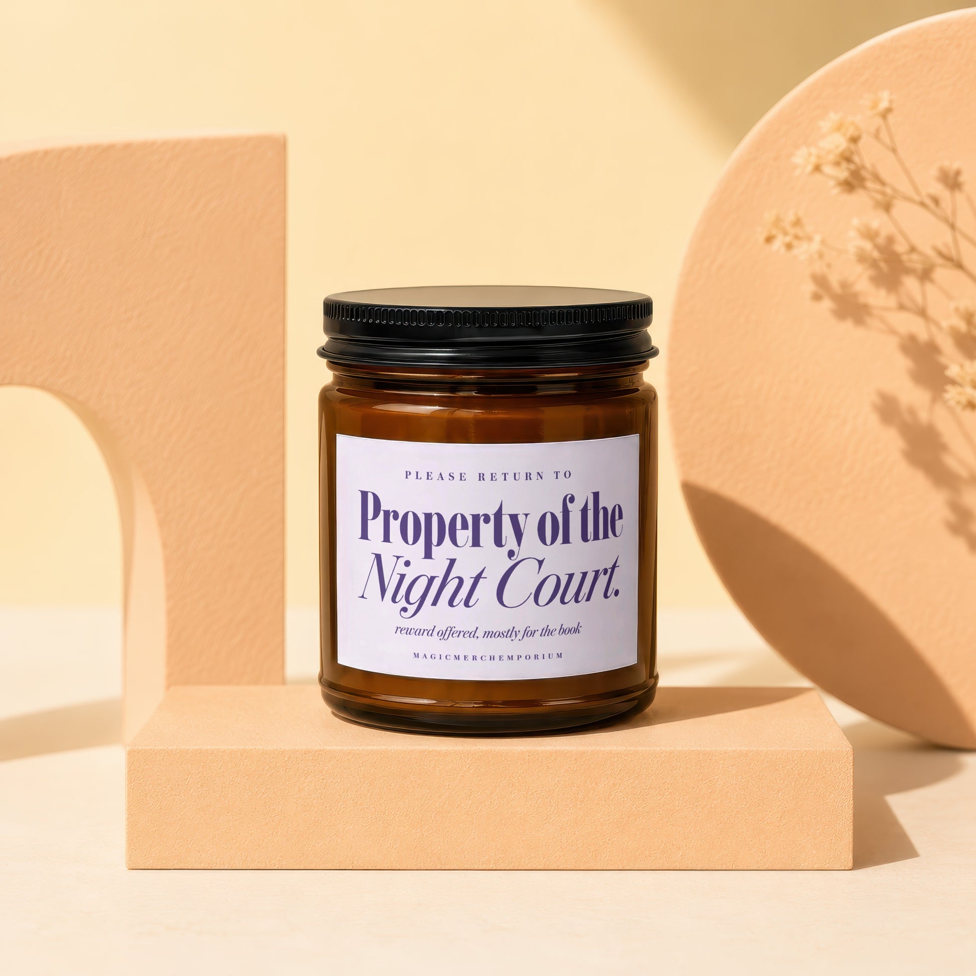 Candle with "Property of the Night Court" label, "reward offered, mostly for the book"