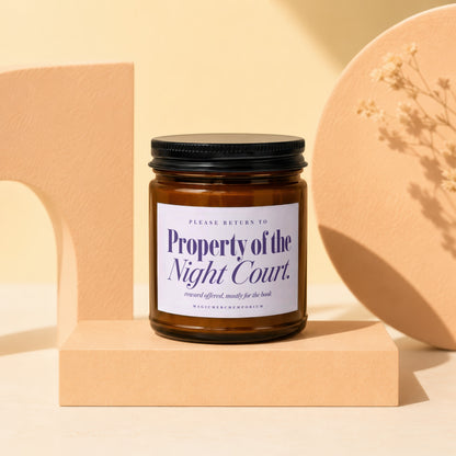 Candle with "Property of the Night Court" label, "reward offered, mostly for the book"
