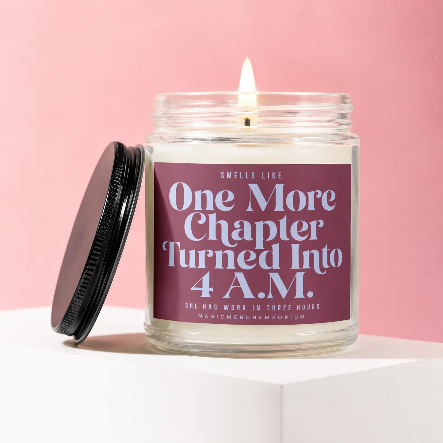 Candle with text "One More Chapter Turned Into 4 A.M." on a pink background.