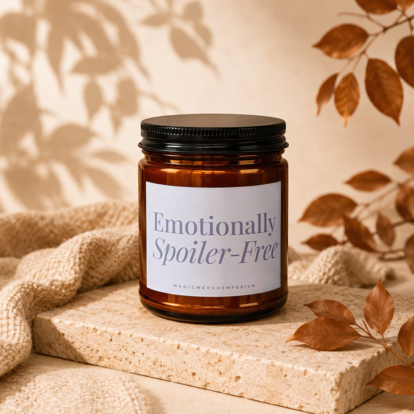 Amber jar candle with "Emotionally Spoiler-Free" label and "MAGICMERCHMMPORIUM" text.