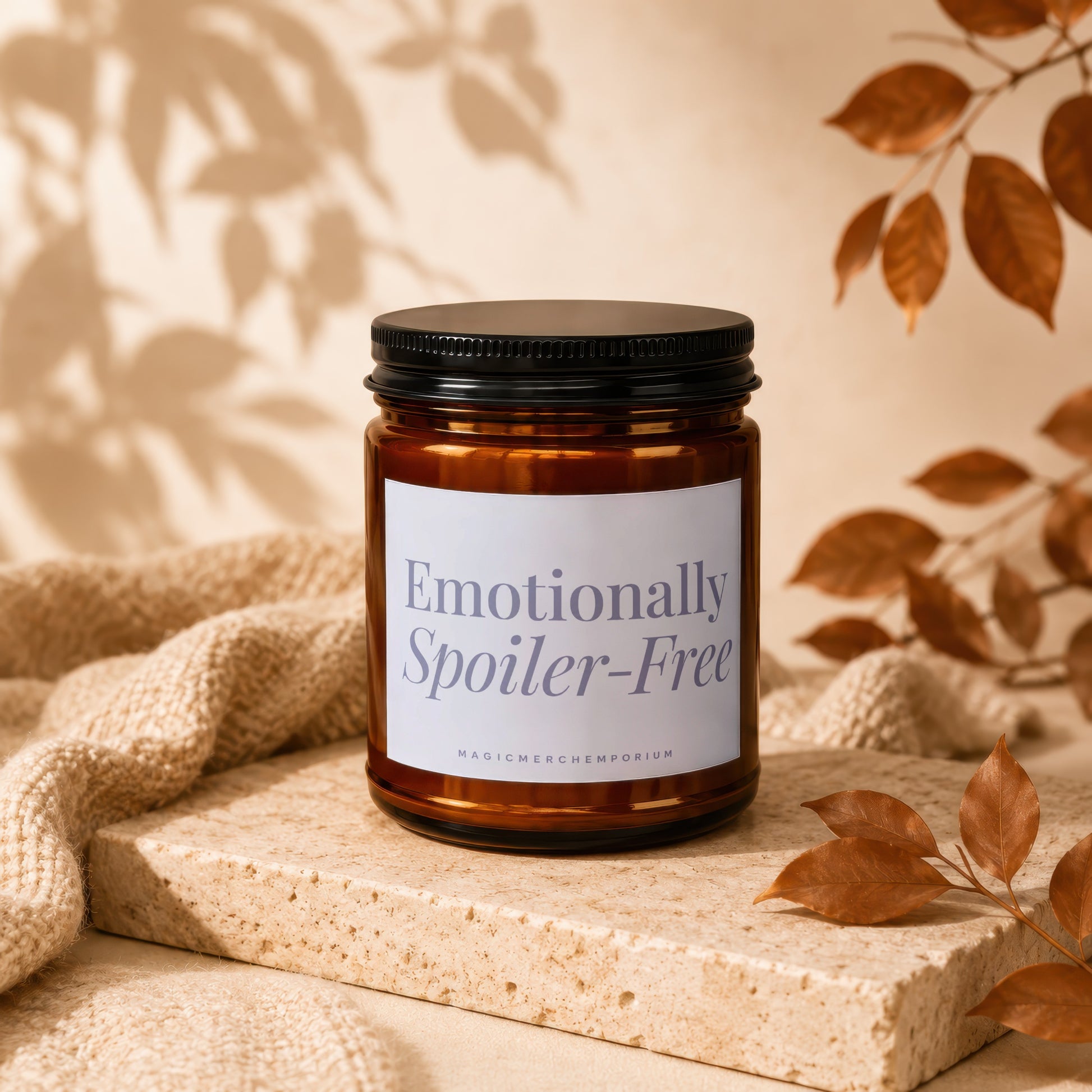 Amber jar candle with "Emotionally Spoiler-Free" label and "MAGICMERCHMMPORIUM" text.