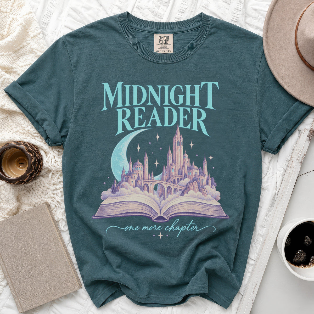 Teal t-shirt with "Midnight Reader" text, castle, moon, and open book.