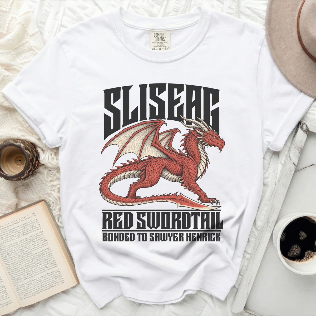 White t-shirt with a red dragon graphic and text "SLISEAC RED SWORDTAIL BONDED TO SAWYER HENRICK".