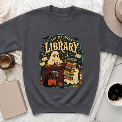 Dark gray sweatshirt featuring a "The Haunted Library" design with ghosts, books, and Halloween elements.