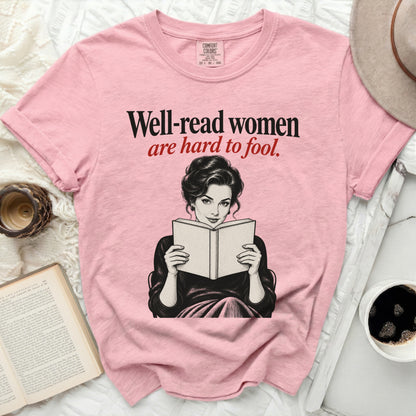 Pink t-shirt with "Well-read women are hard to fool" text and illustration.