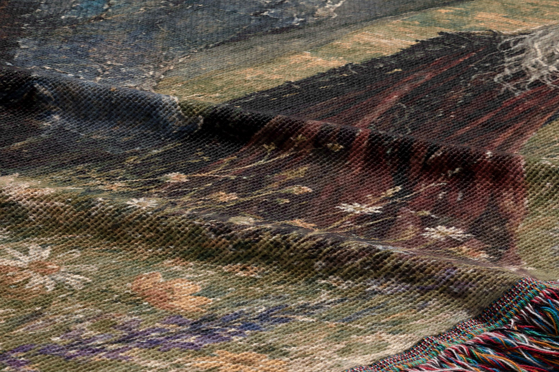 The image is a close-up of a textured fabric with a floral pattern, featuring a mix of green, brown, and white colors.
