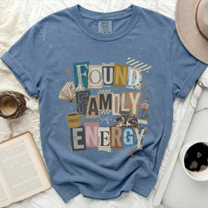 Blue t-shirt with "Found Family Energy" text and a sleeping cat graphic.