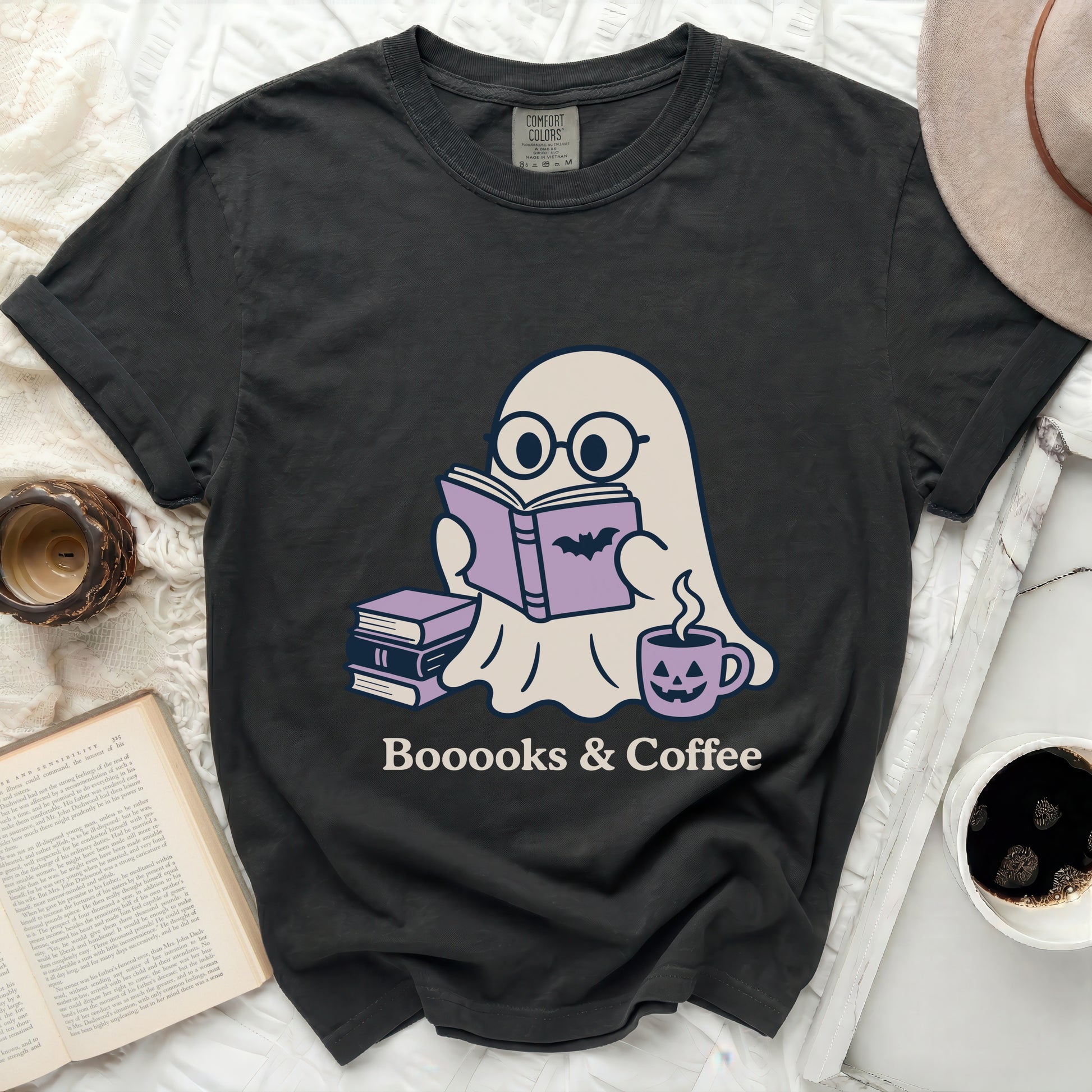 Ghost reading Boooooks & Coffee with stack of books and pumpkin coffee cup.