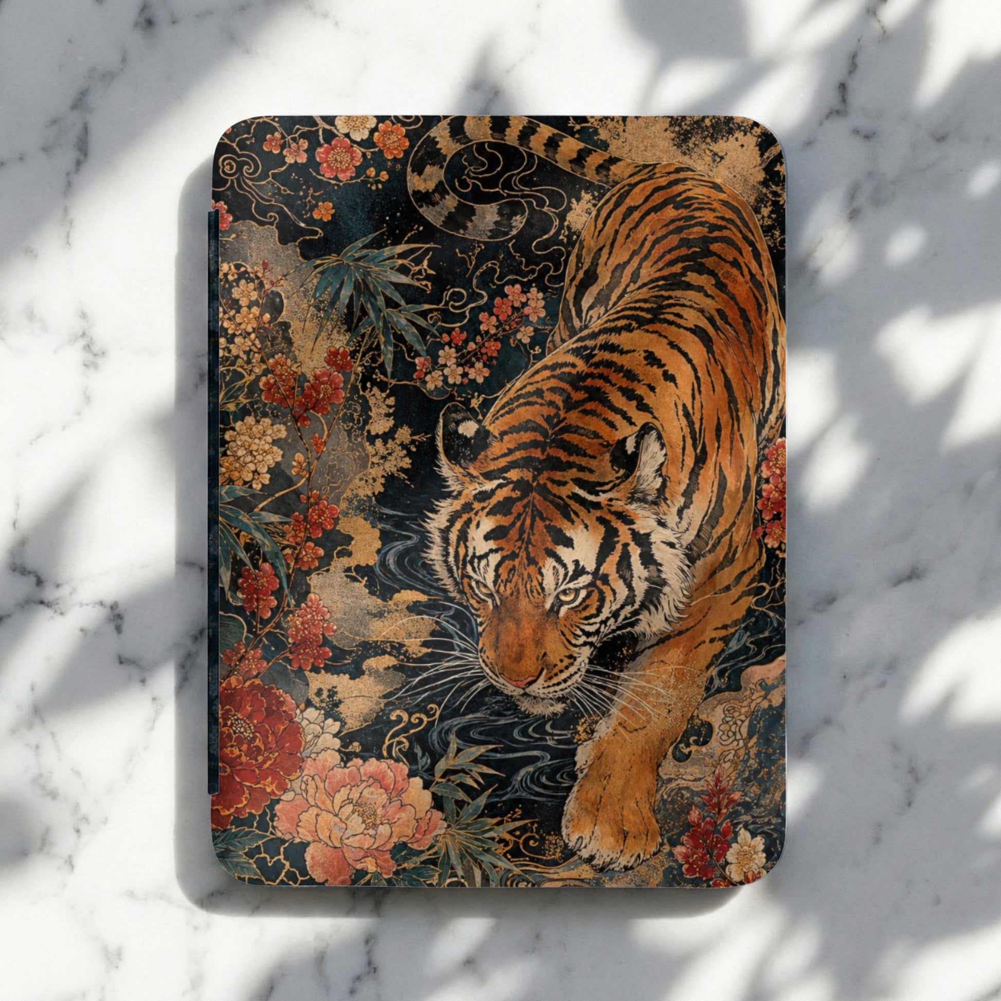 Tiger and floral art on a dark background with swirling gold accents.