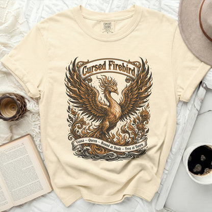 Cream t-shirt with a phoenix design and text "Cursed Firebird Vassa - Queen - Bound at Dusk - Free at Dawn".