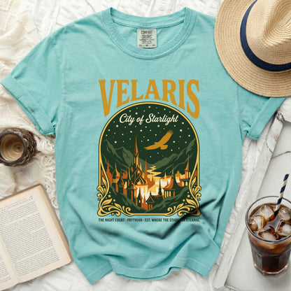 Teal t-shirt with "Velaris City of Starlight" graphic and castle scene.