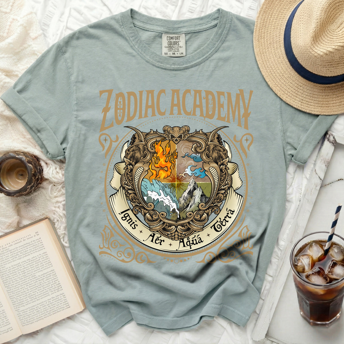 Light blue Comfort Colors t-shirt with "Zodiac Academy" and elemental crest graphic.