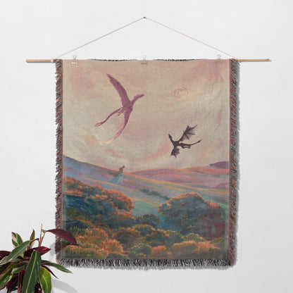 a hanging tapestry depicting a fantastical landscape with a dragon soaring in the sky and a woman walking through the scenery.