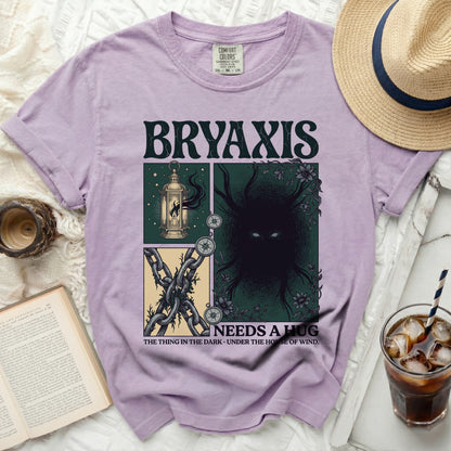 Purple t-shirt with Bryaxis "Needs a Hug" graphic, featuring lantern, chains, and creature.