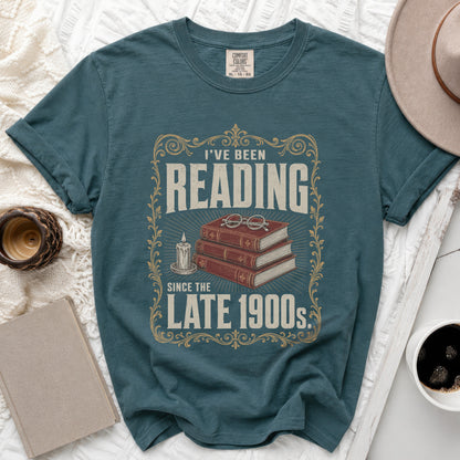 Teal t-shirt with "I've Been Reading Since The Late 1900s" graphic.