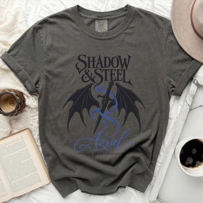 Grey t-shirt with "Shadow & Steel Azriel The Shadowsinger" graphic.