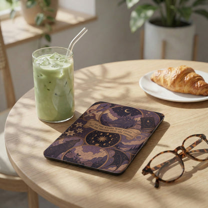 Tablet case with starry night and wolf design on wooden table with latte and croissant.