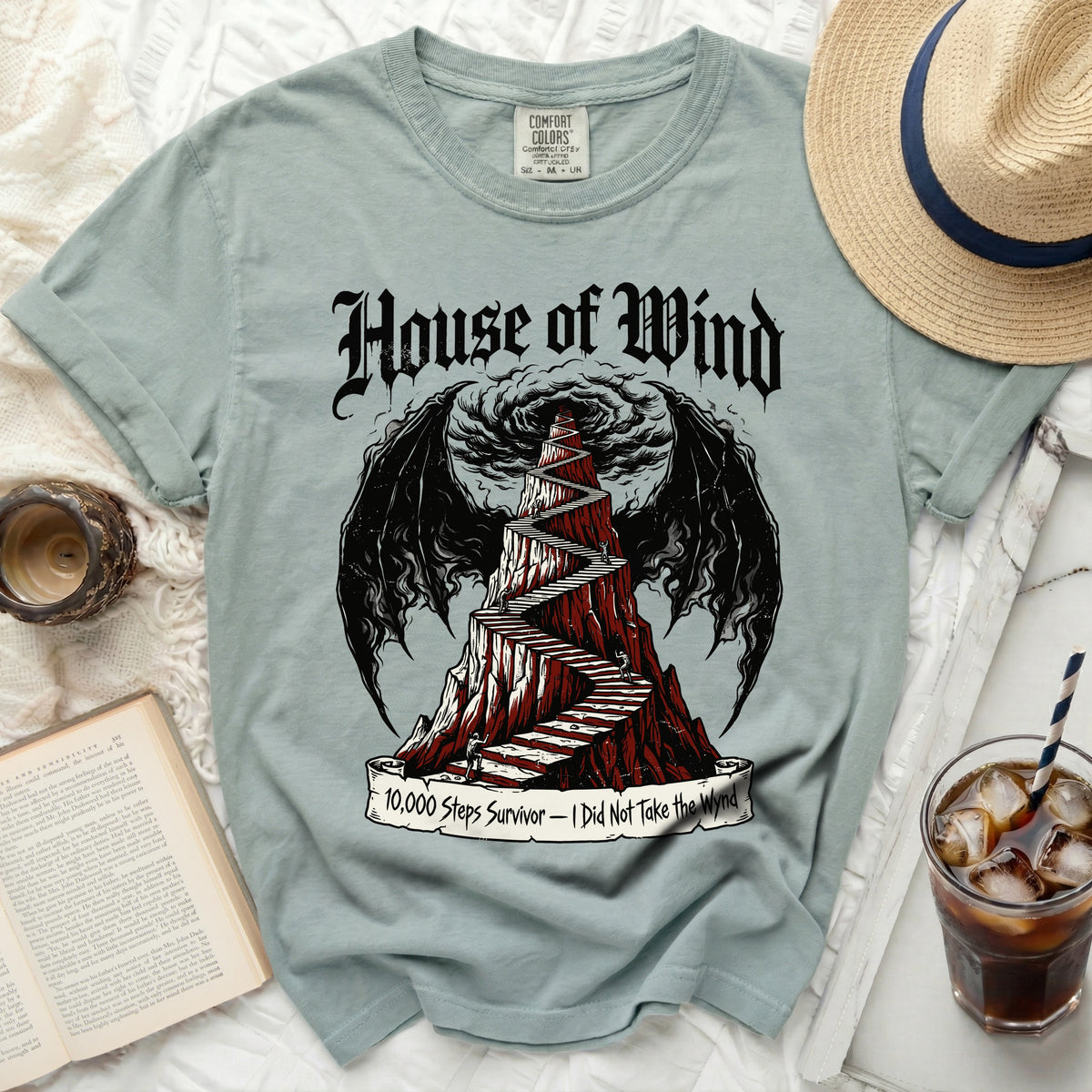 House of Wind shirt with a mountain staircase and dragon wings.