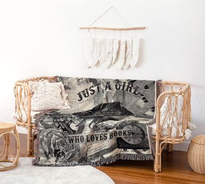 a cozy living space with a woven bench, a woven basket, and a woven wall hanging. The bench is adorned with a blanket that has the phrase "Just a girl who loves books" printed on it.