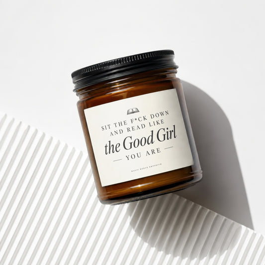 Amber jar candle with "Sit the F*ck Down and Read Like the Good Girl You Are" text.