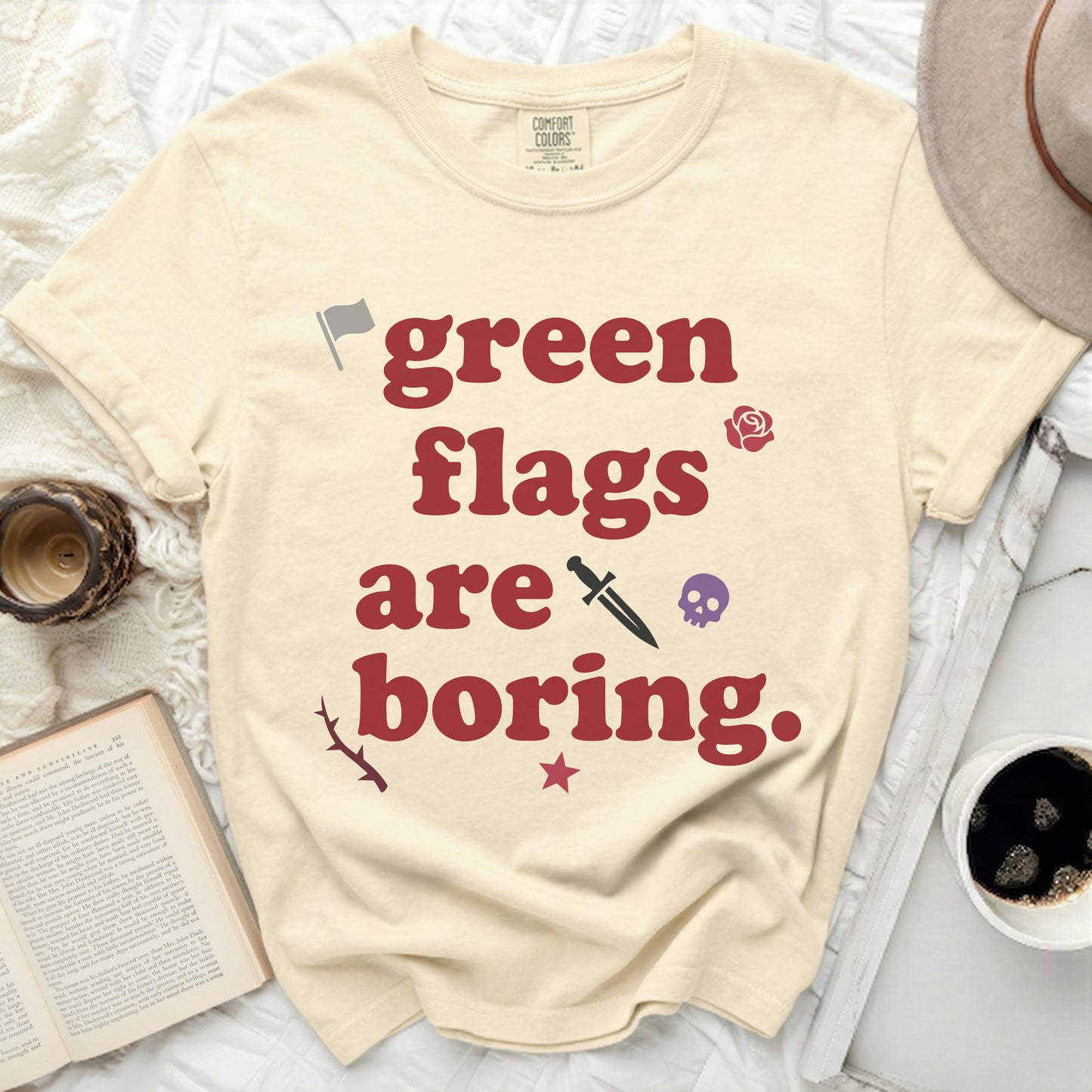 Cream t-shirt with "green flags are boring" text and icons.