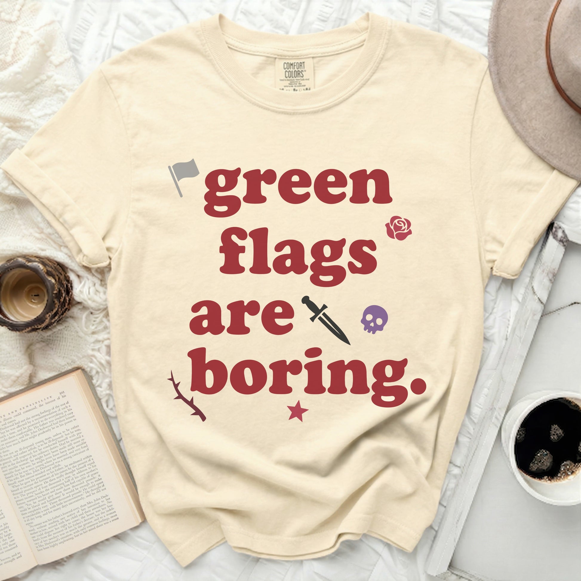 Cream t-shirt with "green flags are boring" text and icons.