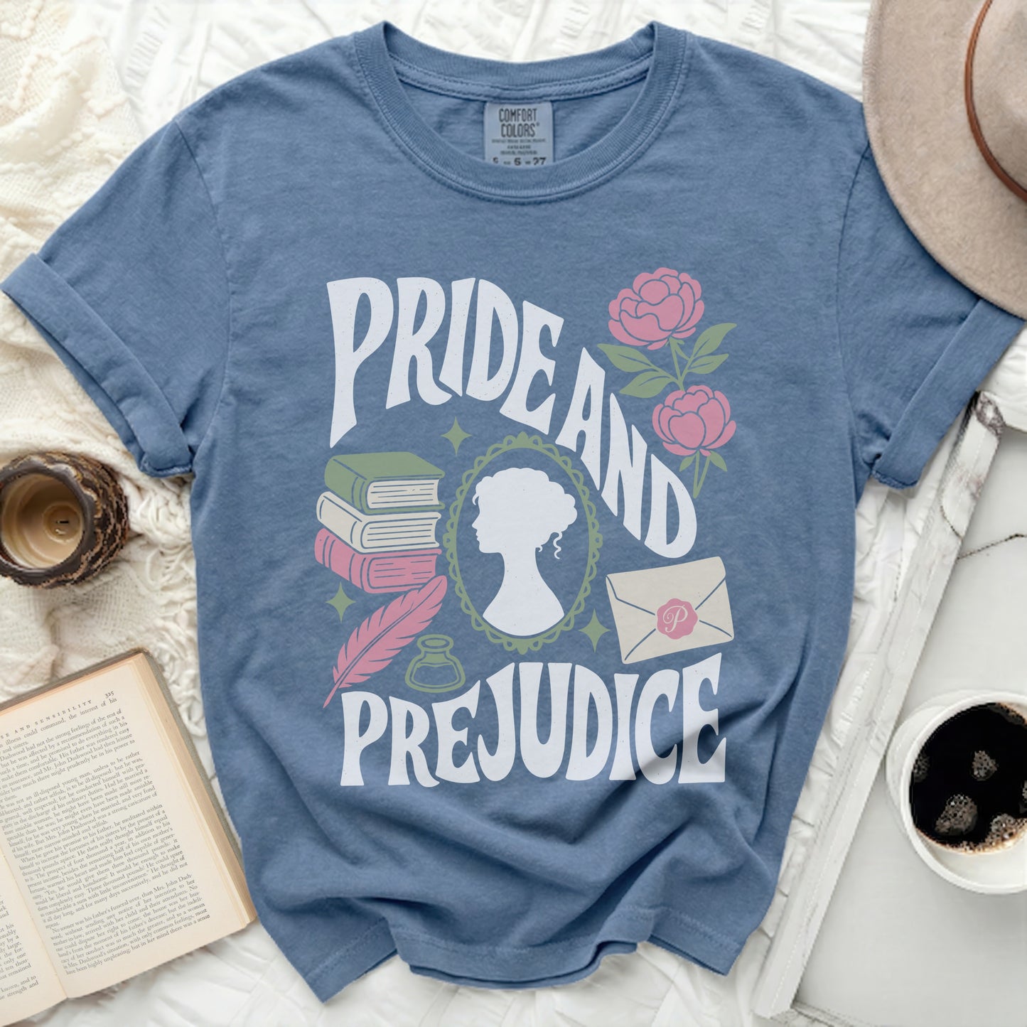 Pride and Prejudice t-shirt with stacked books, quill, and silhouette.