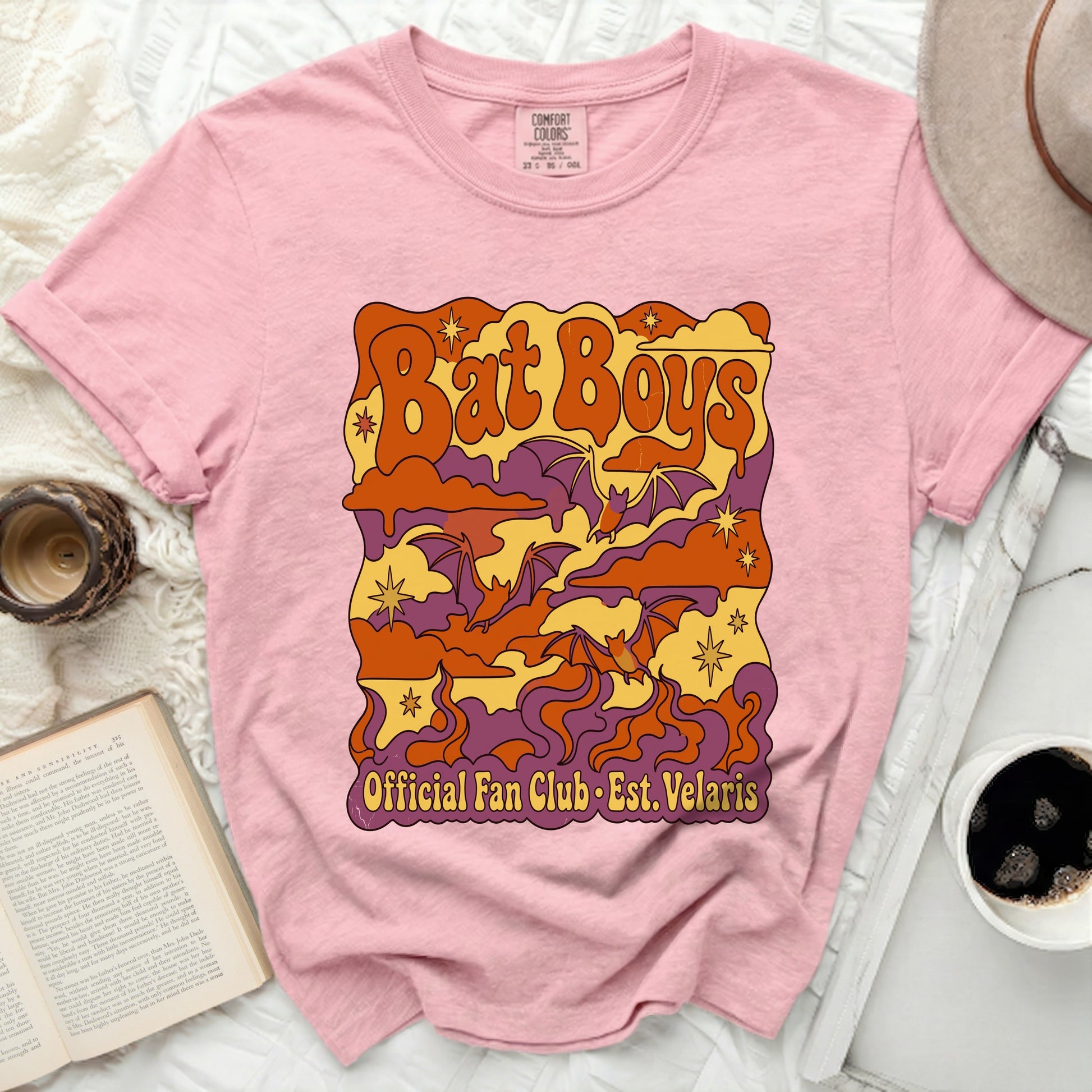 Pink t-shirt with "Bat Boys Official Fan Club Est. Velaris" text and bats.