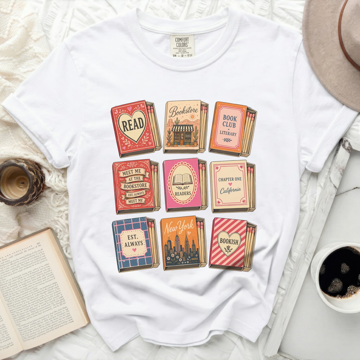 White t-shirt with stacked books and text graphics: Bookstore, Readers, Bookish.