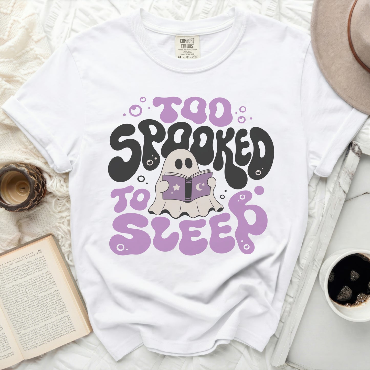 White t-shirt with "Too Spooked to Sleep" ghost graphic