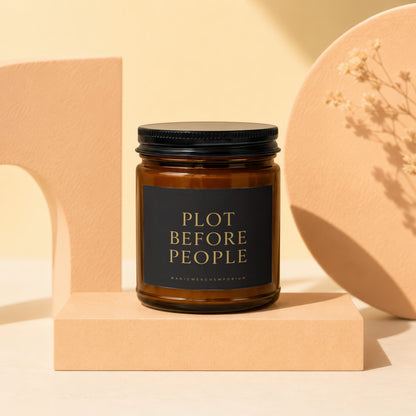 Amber glass candle with black lid and "PLOT BEFORE PEOPLE" label.