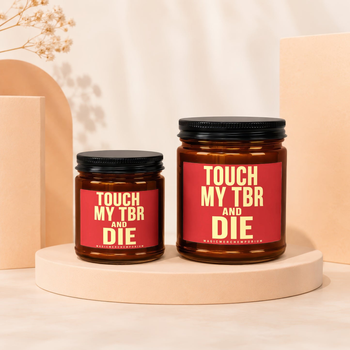 Two amber jars with black lids and red labels reading "TOUCH MY TBR AND DIE" and "MAGICMERCH."},