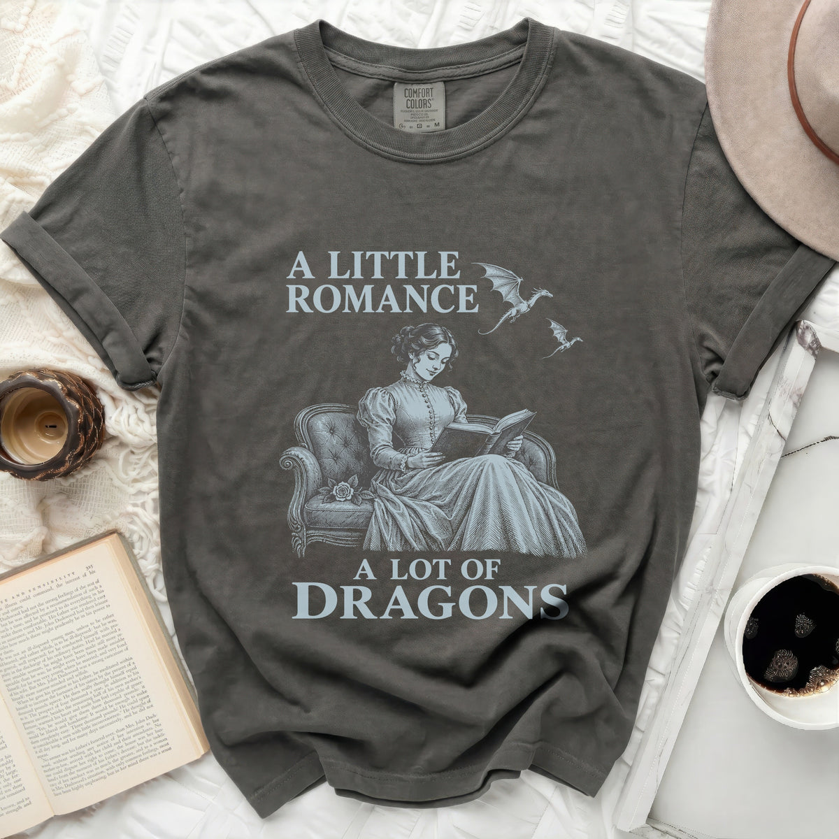 T-shirt with "A Little Romance A Lot of Dragons" text and dragon graphic.