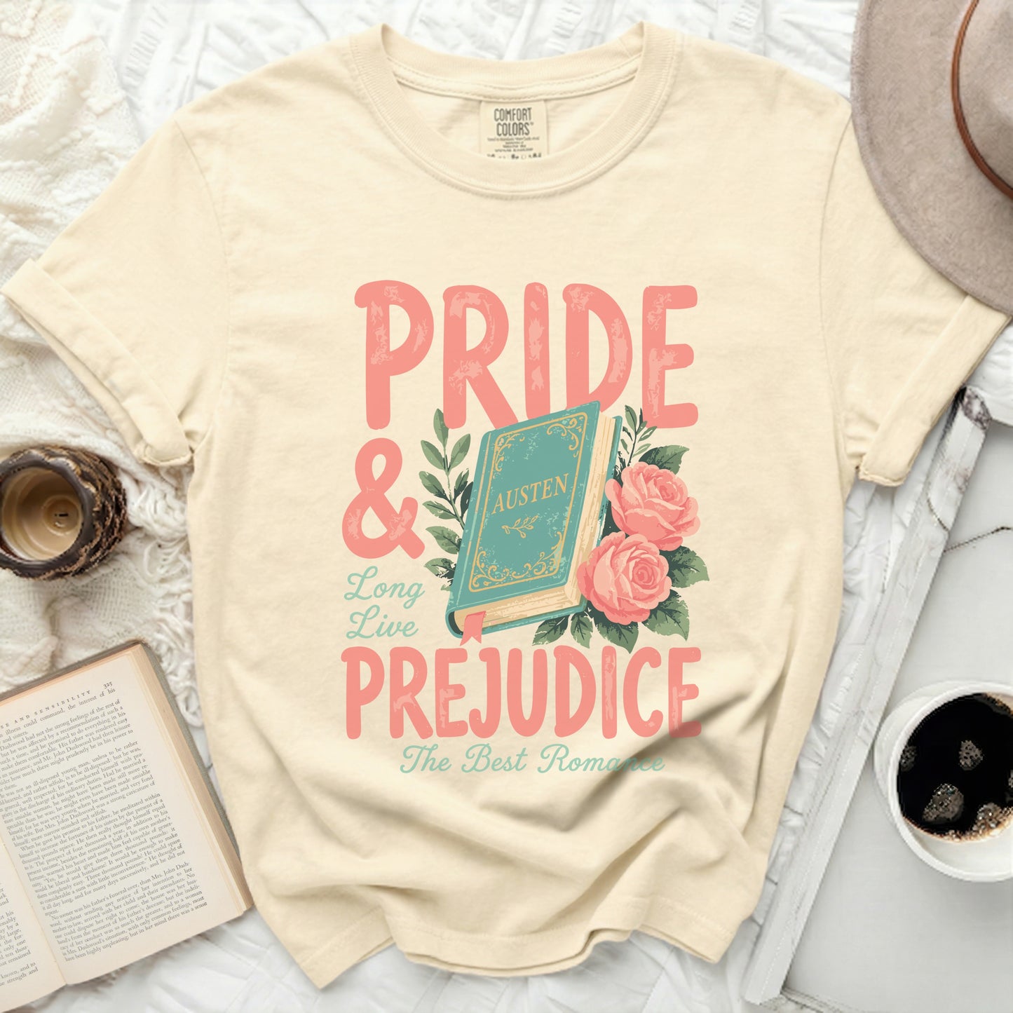 Cream t-shirt with pink Pride & Prejudice text and book graphic.