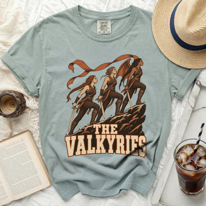 T-shirt with graphic of "The Valkyries" and swords on a rock formation.