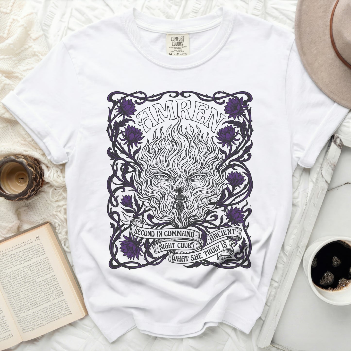 White t-shirt with "AMREN" and fiery wolf design with purple flowers.